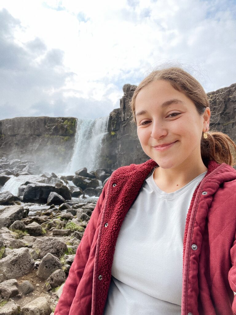 selfie of annabelle in front of a waterfall in Iceland